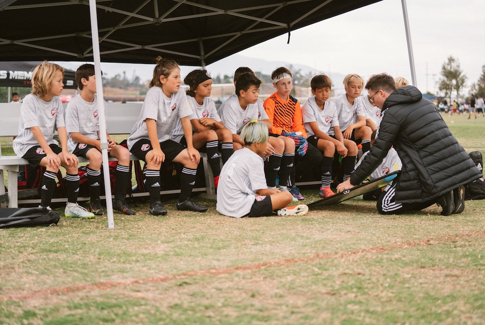soccer coach on field